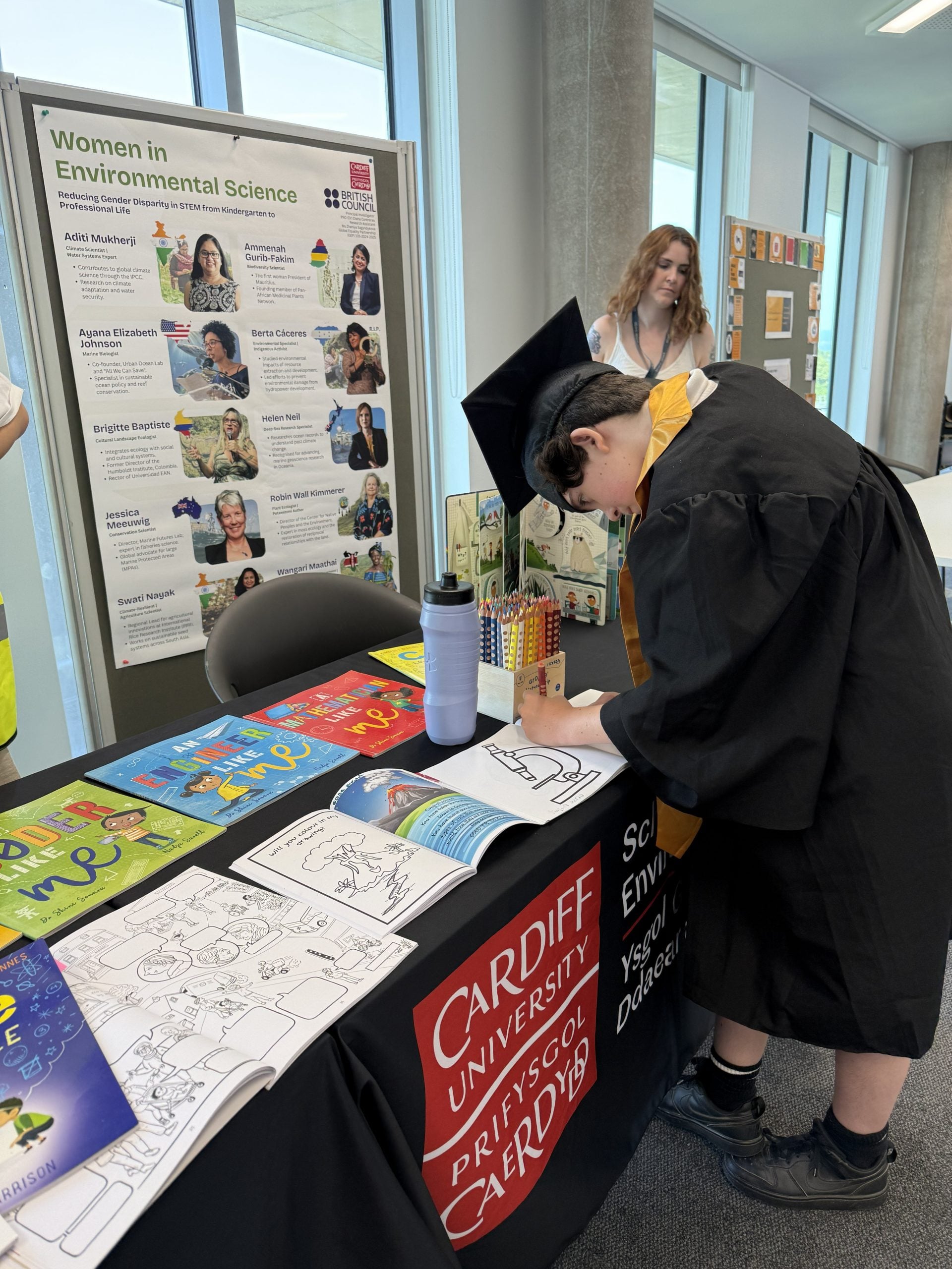 Figure 2. Kid colouring a book after his graduation. Photo: Dr (PhD)Diana Contreras.